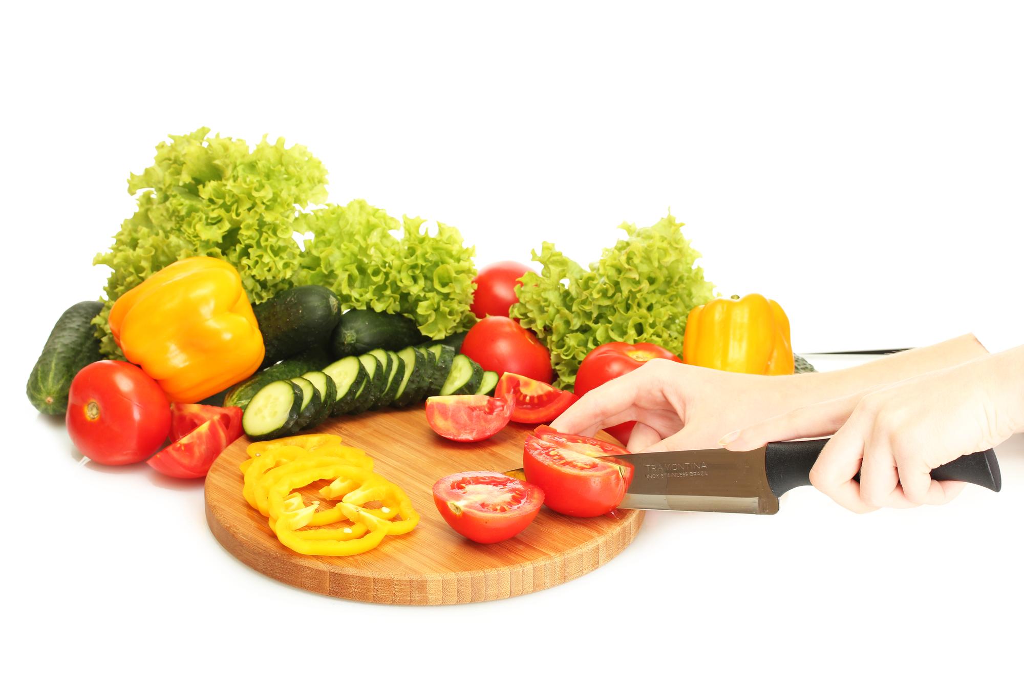 Hands chopping vegetables for a fast recipe